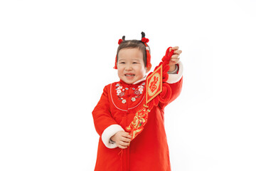 Traditional dress of Chinese baby girl with traditional Pendant in her hand