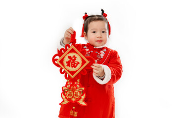 Traditional dress of Chinese baby girl with traditional Pendant in her hand