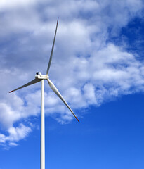 Wind turbine and blue sunlight sky
