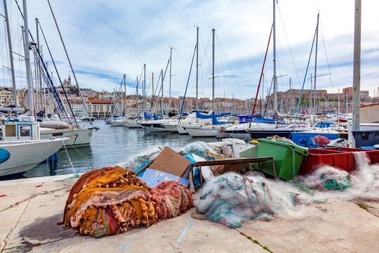 fishernet at the pier in the old harbor of Marseille with lot of sailing boats