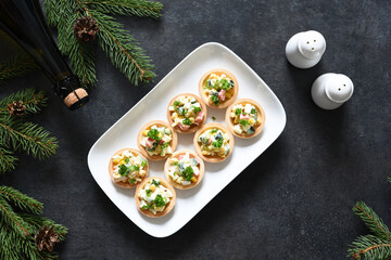 Tartlets with salad on the New Year's table.with salad with crab sticks © zefirchik06