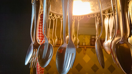 Luminaire is made of spoons and forks