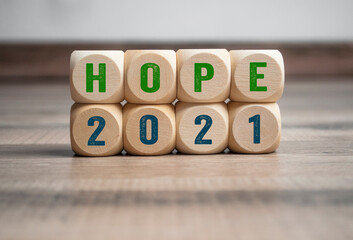 Pieces of wood, cubes and light box with message goals 2021 and hope 2021 on wooden background