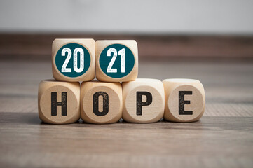 Pieces of wood, cubes and light box with message goals 2021 and hope 2021 on wooden background