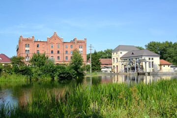 View of the Vikhert mill and the building of the engine hall of the Ozerskaya hydroelectric station...