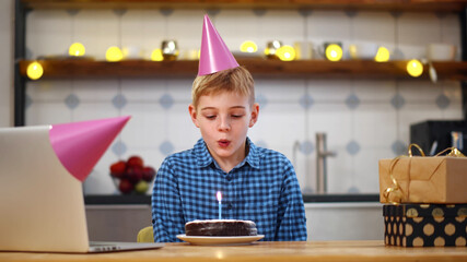 Cute preteen boy celebrating birthday online in quarantine time