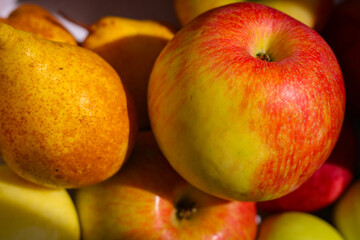 Several red-green apples standing on top of each other