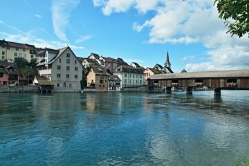 Fototapeta na wymiar Switzerland-View on the river Rhine and old wooden bridge in town Diessenhofen