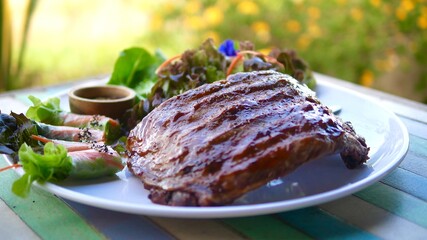 Tasty grilled ribs with vegetables