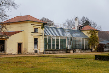 Classic style castle greenhouse with large wooden windows, Romantic baroque chateau in winter day, Libochovice, Litomerice district, Bohemia, Czech Republic