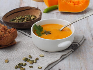 Fresh pumpkin soup with pumpkin seeds