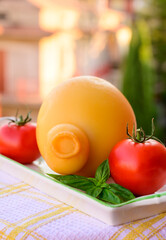 Cheese collection, Italian cheese provolone or caciocavallo made from sheep or cow milk in South Italy, yellow smoked.