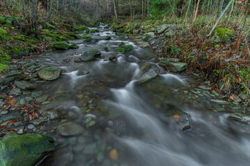 Fototapeta na wymiar Waterfall on Bucaci creek in Moravskoslezske Beskydy mountains in winter day