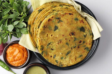 (Thepla) / Indian flat bread,Methi Paratha, Indian flatbread stuffed with fenugreek leaves and spices served with yogurt in breakfast or brunch .

