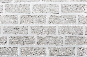 Grey brick wall imitation texture. White and beige plaster background.