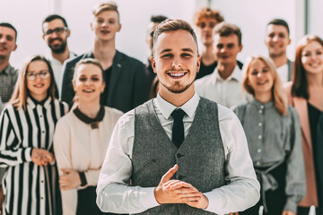 business man standing in front of a group of diverse young peop