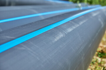 Close-up of polyethylene pressure pipes lying before installation