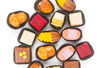 Up view on chocolate praline candies isolated on white background