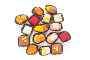 Up view on chocolate praline candies isolated on white background