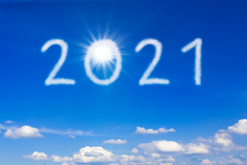 Better New Year concept. 2021 text on blue sky during a sunny day, signifying a brighter and better...