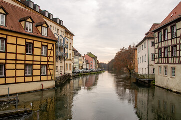 Fototapeta na wymiar Bamberg, Germany, 20.12.2020. View from the Upper Muehl Bridge over the Regnitz towards the historic old town. High quality photo