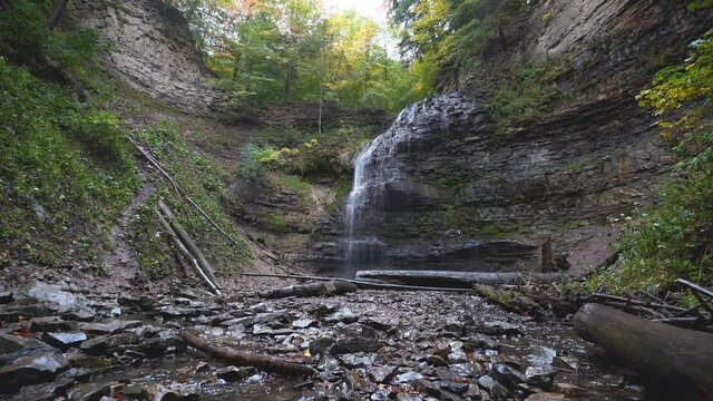 Water flows over Tiffany Falls during an autumn rain shower