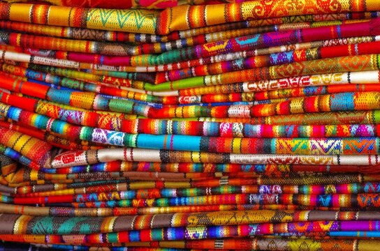 Colorful market with beautiful and unique handicraft fabric patterns available in Ecuador