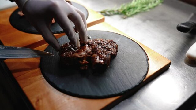 Cooking beef steak at home, Beef fillet on the Cut Board, Juicy steak with grilling stripes