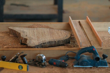Hand tools and power tool with  slab coffee table. Woodworking and carpentry production .Furniture manufacture