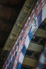 Details of the colorful arches of Notre Dame Cathedral romanesque cloister in le Puy en Velay (Auvergne, France)