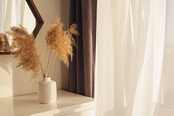 Pampas grass in vase on the dresser