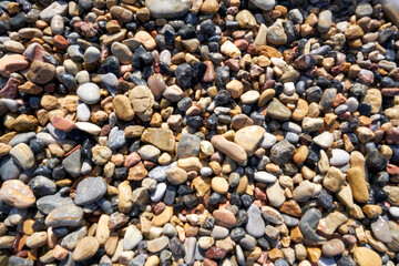 The image of stones and pebbles exposed to waves for years