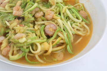 fresh and raw zucchini spaguetti with prawns as imitation of italian pasta for vegetarian food