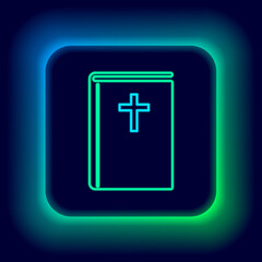 Glowing neon line Holy bible book icon isolated on black background. Colorful outline concept. Vector.