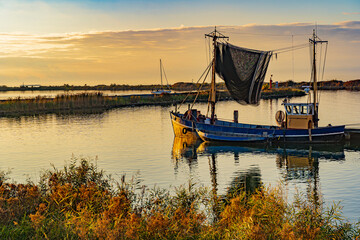 An old fishing boat at sunset in the Netherlands