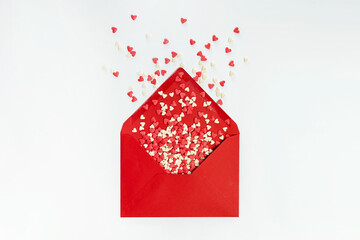 Sugar heat shaped sprinkles fly out of red envelope