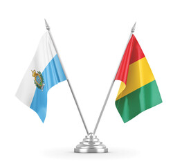 Guinea and San Marino table flags isolated on white 3D rendering