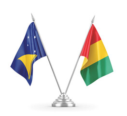 Guinea and Tokelau table flags isolated on white 3D rendering