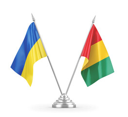 Guinea and Ukraine table flags isolated on white 3D rendering