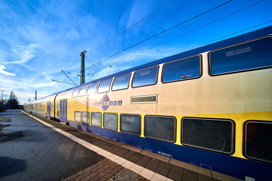 Train of the Metronom regional train stands on the tracks at the platform edge of the station in Uelzen, Germany, December 18., 2020: