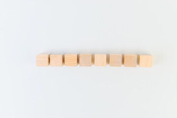 Eight wooden cubes on a white background