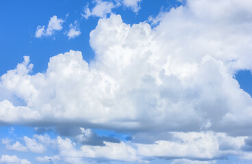 Blue skies in good weather. Cumulus and cirrus clouds. Photo, image.