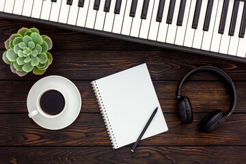 Musician work set with synthesizer, note and headphones
