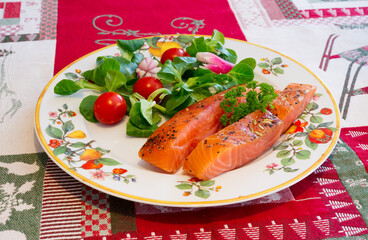 thick slices of homemade smoked salmon on a festive tablecloth