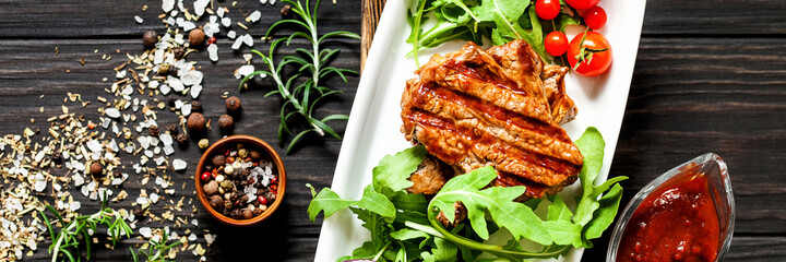 Grilled beef steak. Top view. Banner