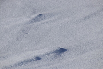 ice and snow structures on a frozen lake in finland