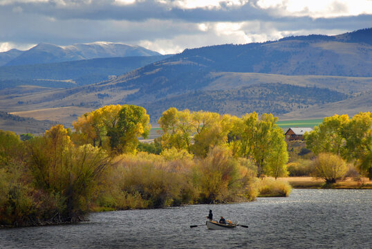 Anglers floating a Montana river and fishing in the fall in Montana and fly fishing from a drift boat