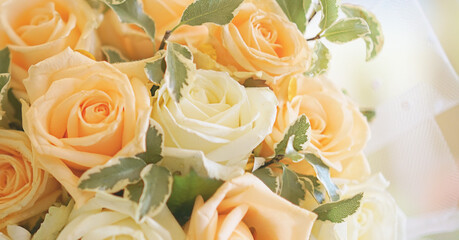 Bouquet of white and yellow roses lying on table close view.
