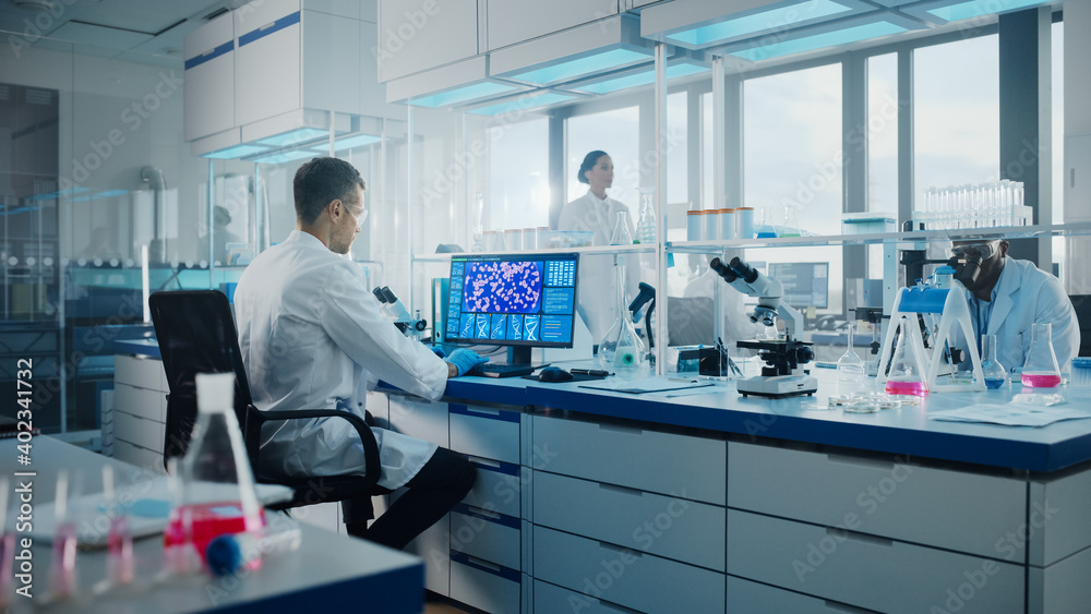 Wall mural medical science laboratory with diverse multi-ethnic team of biotechnology scientists developing dru