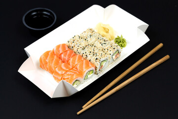 Sushi To Go concept, takeaway paper box with sushi rolls